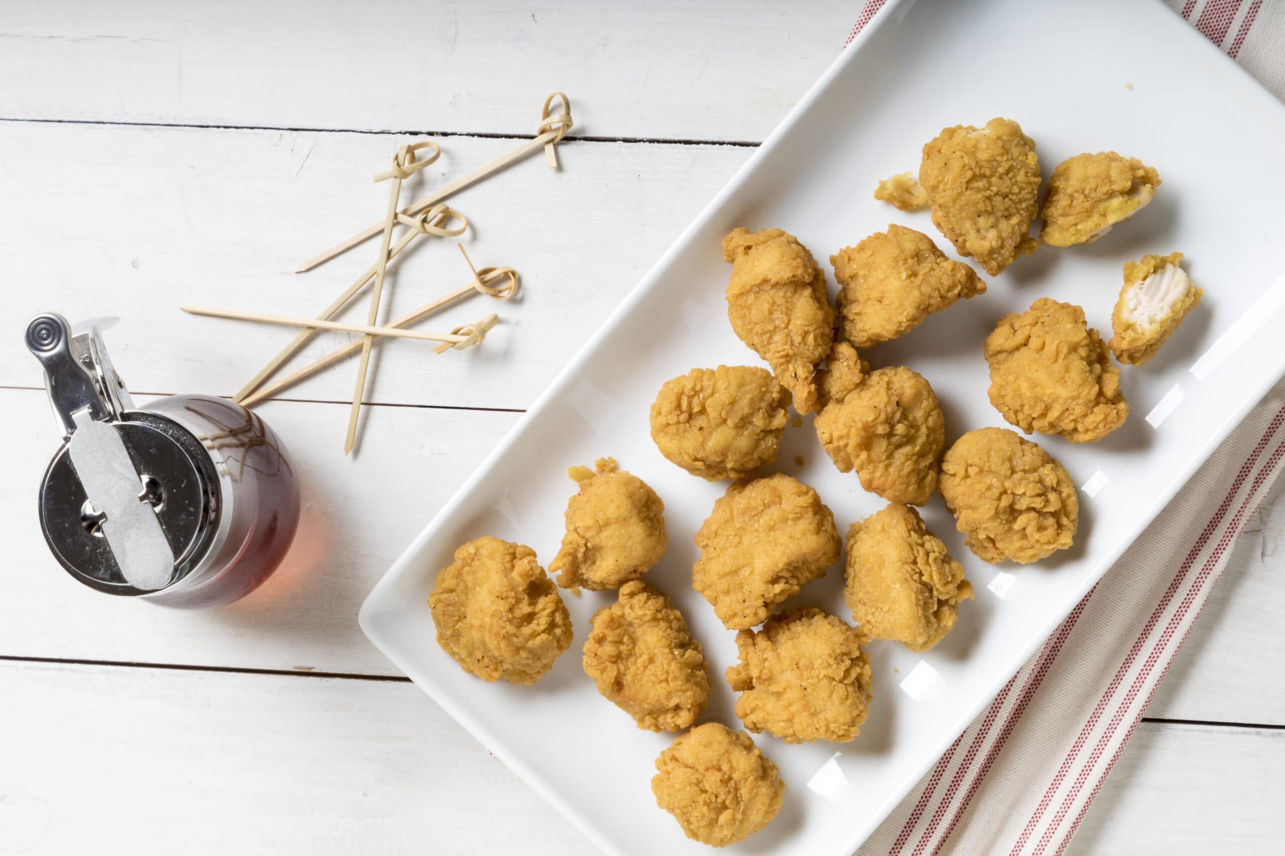 White plate of chicken nuggets